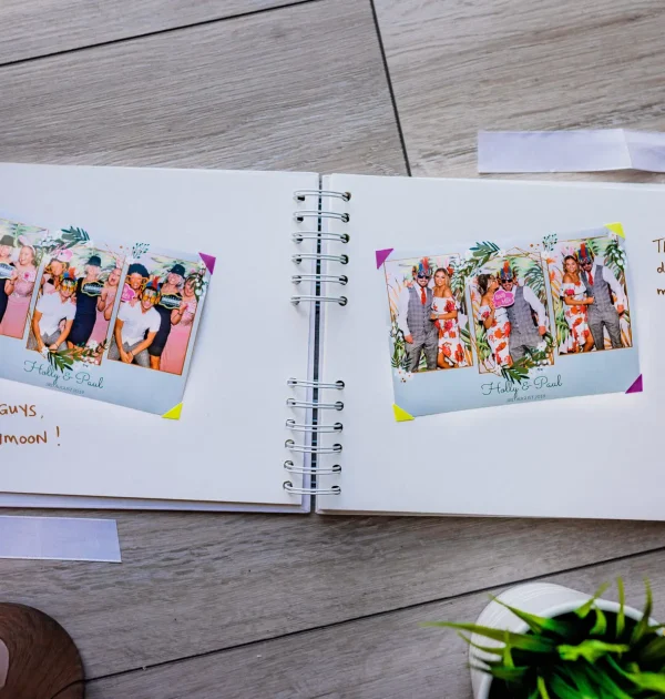 The guest book waiting for guests to sign and add copies of their photos to